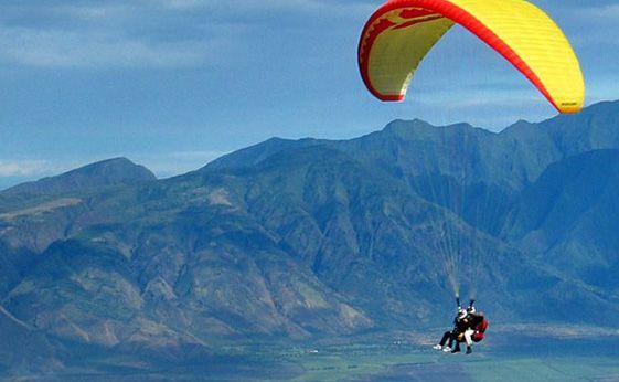 Paragliding over the scenic hills of Naukuchiatal – a thrilling adventure activity in Nainital.